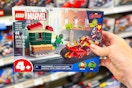 hand holding a lego marvel spiderman set