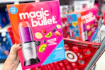 hand holding a magic bullet blender set in front of target cart