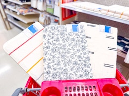 3 target bath rugs sitting in a cart