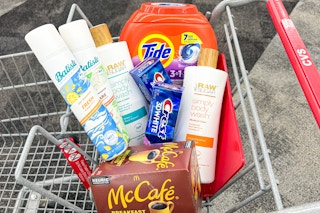 tide pods, batiste dry shampoo, raw sugar body wash, crest toothpaste, and mccafe kcups in a cart