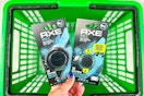 hand holding axe car air fresheners above green shopping basket