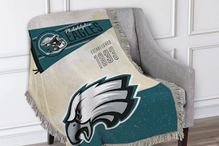 a NFL Eagles woven tapestry on a chair