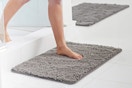 Lifestyle image of the grey GORILLA GRIP Chenille Bath Rug being used in bathroom