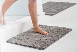 Lifestyle image of the grey GORILLA GRIP Chenille Bath Rug being used in bathroom