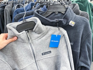 A Columbia jacket held with hand.