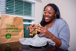 Person holiding a publix sandwich