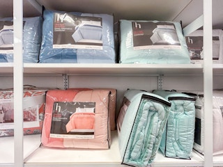 display of reversible comforters in different colors