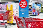 photo of a target shopping cart near a deal of the day sign