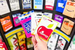 hand holding gift cards