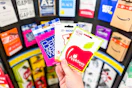 hand holding gift cards