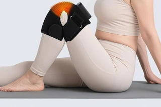 a woman using a knee massager