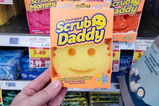 hand holding a scrub daddy scrubber sponge