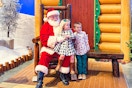 two kids next to Santa at Bass Pro Shops