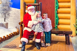 two kids next to Santa at Bass Pro Shops