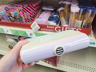 hand holding a mini caboodle dupe