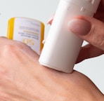 a sunscreen stick applied on a hand