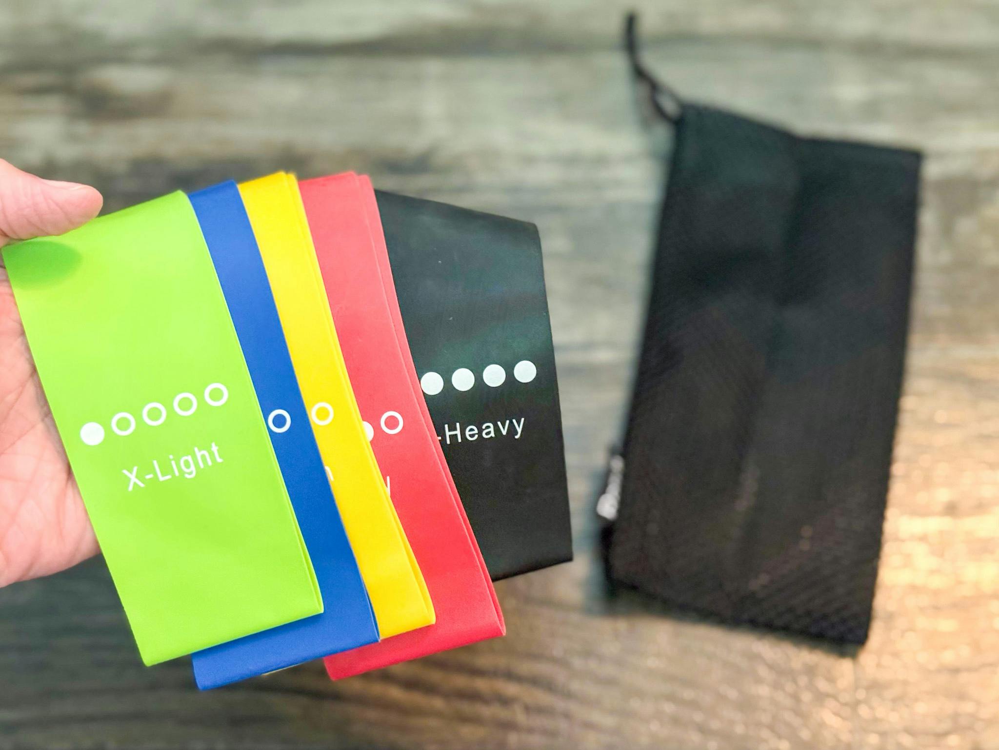 a hand holding resistance bands