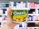 hand holding a tub of deans dip