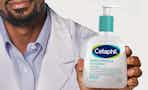 someone holding Cetaphil Gentle SA Cleanser