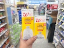 hand holding walgreens trash bags