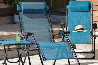 a blue patio chair with another behind it