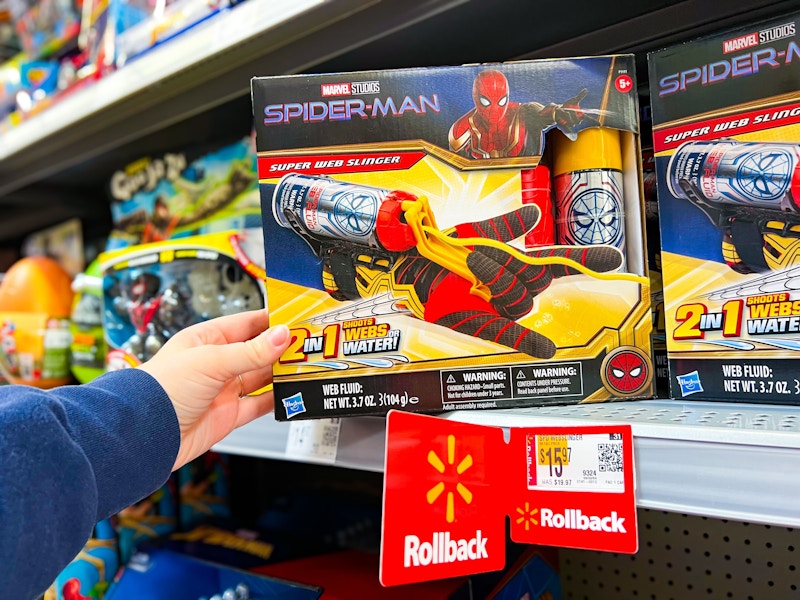 hand holding spiderman web slinger on walmart shelf