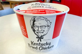 bucket of kfc chicken in bucket on table