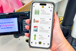 hand holding smartphone displaying 1-clip coupons in the KCL app