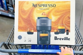 A cart with a  Nespresso coffee maker in store 