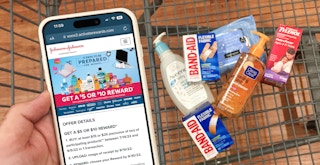 Someone holding a phone displaying the Offer Details for the Johnson & Johnson back to school rebate with a cart of eligible products ...