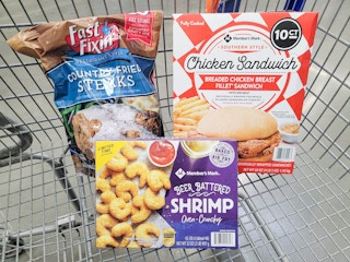 battered shrimp, chicken sandwiches, and country fried steak in a cart