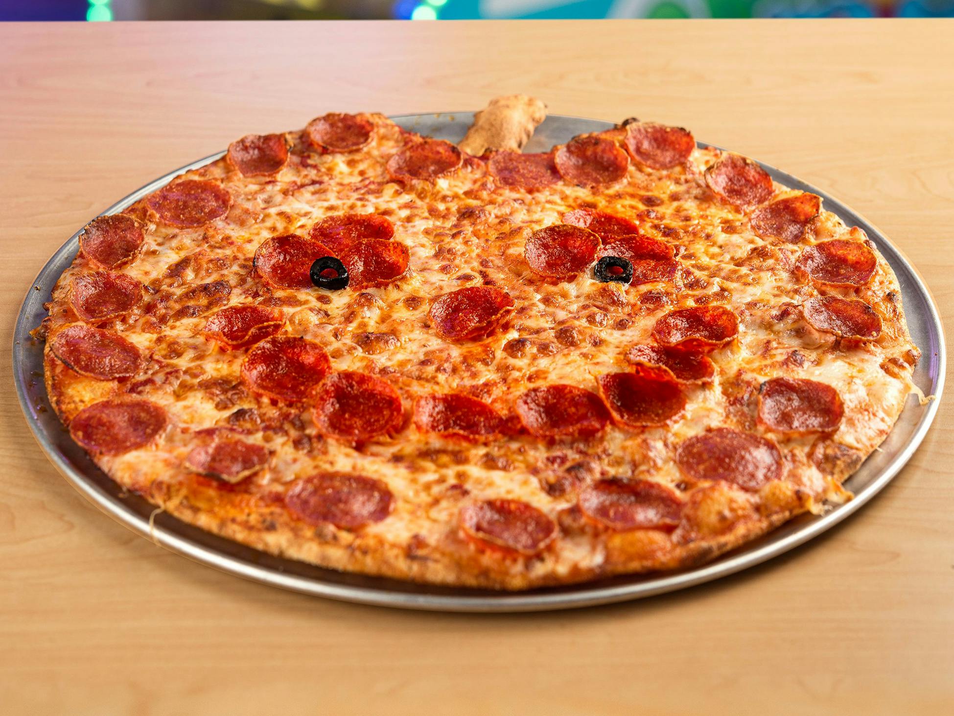 It's Pumpkin-Shaped Halloween Pizza Season: Where to Get One