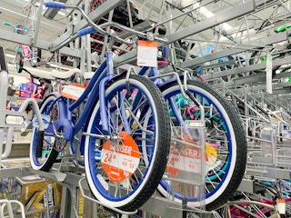 huffy cranbrook periwinkle cruiser adult bike on bike rack at walmart