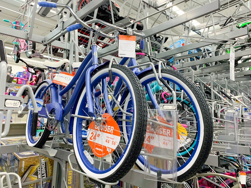 huffy cranbrook periwinkle cruiser adult bike on bike rack at walmart
