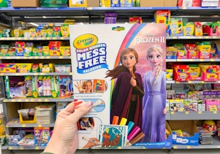 crayola disney frozen II mess free coloring pack held in front of crayola products