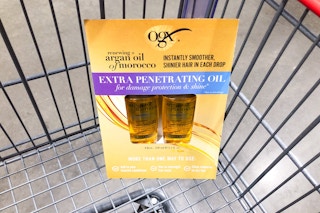 ogx renewing argan hair oil 2 pack in a cart at costco