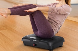 a woman on a vibration plate