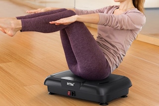 a woman on a vibration plate