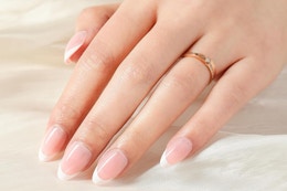 french tip nails on a woman's hand