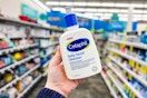 person holding a bottle of cetaphil cleanser in an aisle