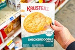 hand holding a box of krusteaz cookie mix