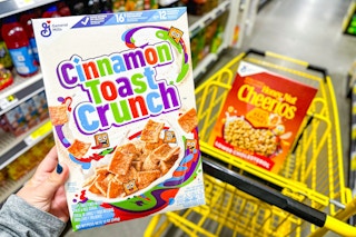 general mills cereal in hand and in shopping cart