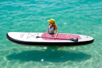 a person on a paddle board in an ocean