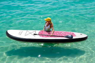 a person on a paddle board in an ocean