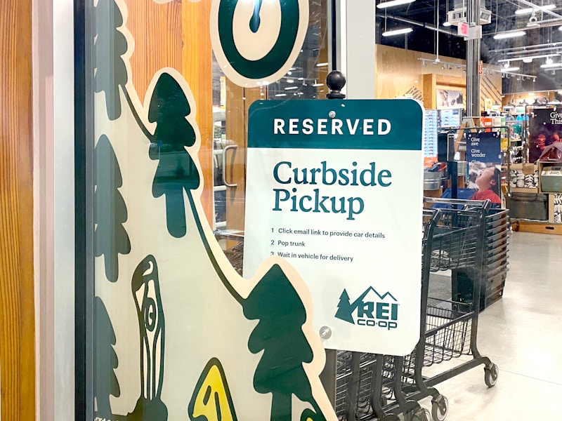 rei co-op curbside pickup sign inside store