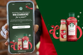 a hand holding a cellphone with the win starbucks on screen with the 2 starbucks items next to it