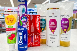 oral-b toothbrush, burt's bees toothpaste, colgate toothpaste, and pantene shampoo and conditioner on a store counter