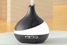 Essential oil diffuser sitting on a counter top.