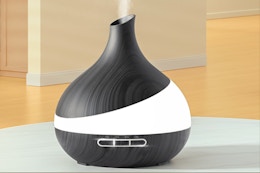 Essential oil diffuser sitting on a counter top.