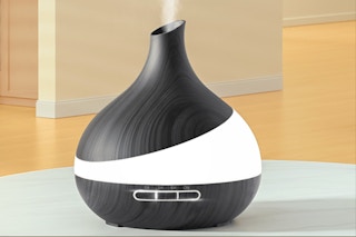 Essential oil diffuser sitting on a counter top.